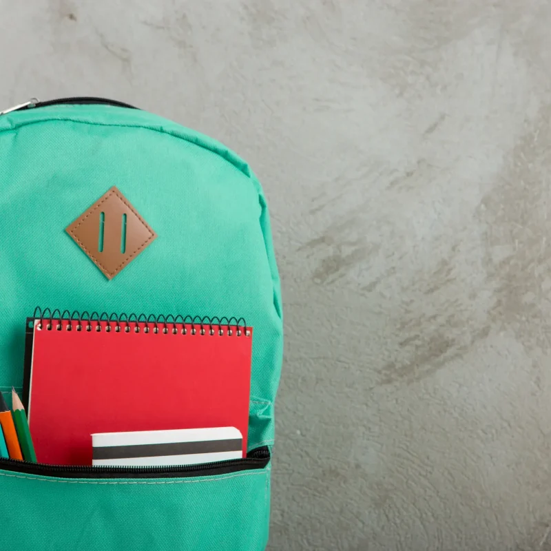 backpack with red notebook